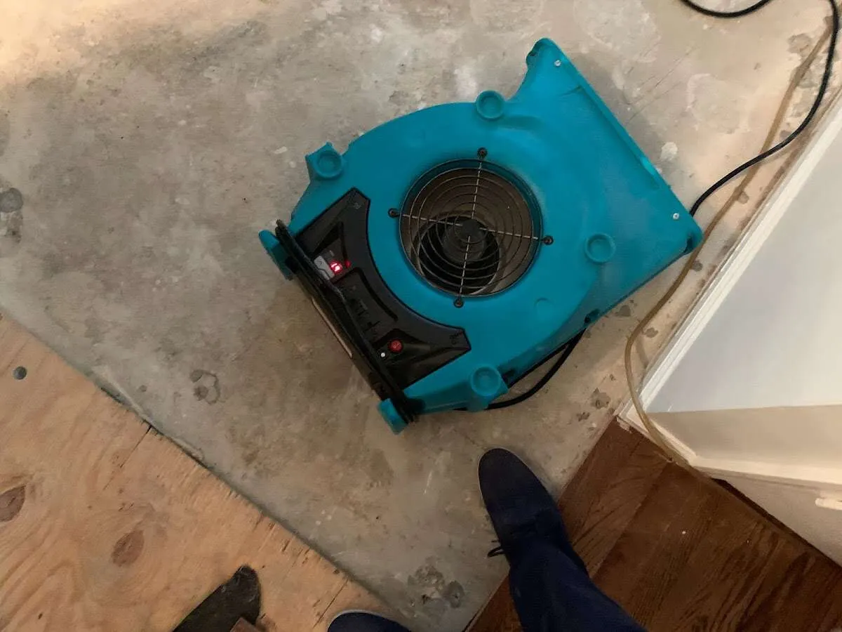 Air mover drying subfloor during Leak Detection & Repair in Fountain Valley